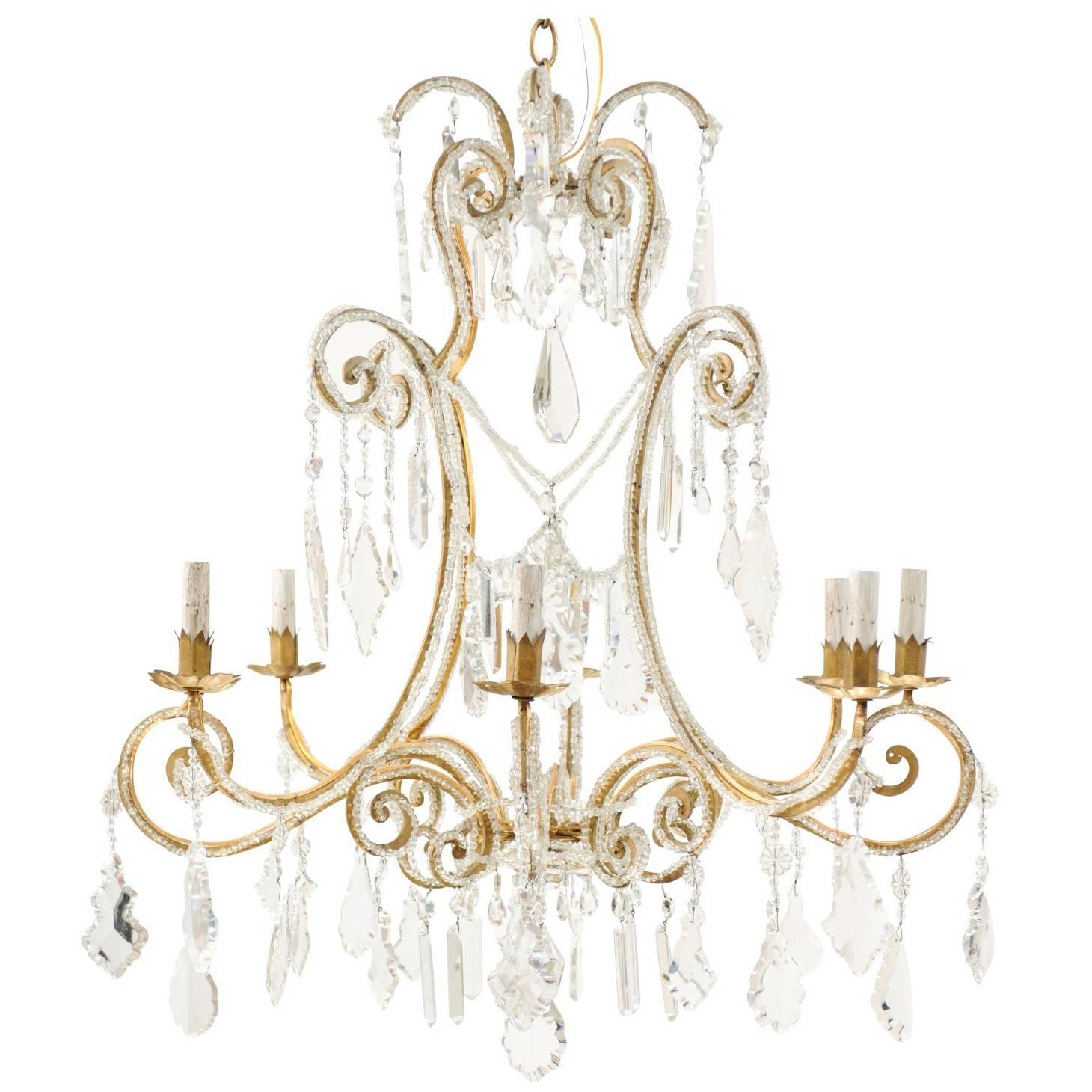 Italian Eight-Light Crystal and Gilded Iron Chandelier with Ornate Scroll Design