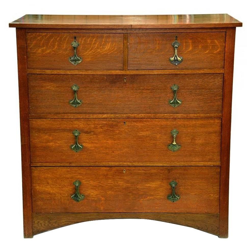 Heals. An Arts and Crafts Oak Chest of Drawers, Stamped Heals of London