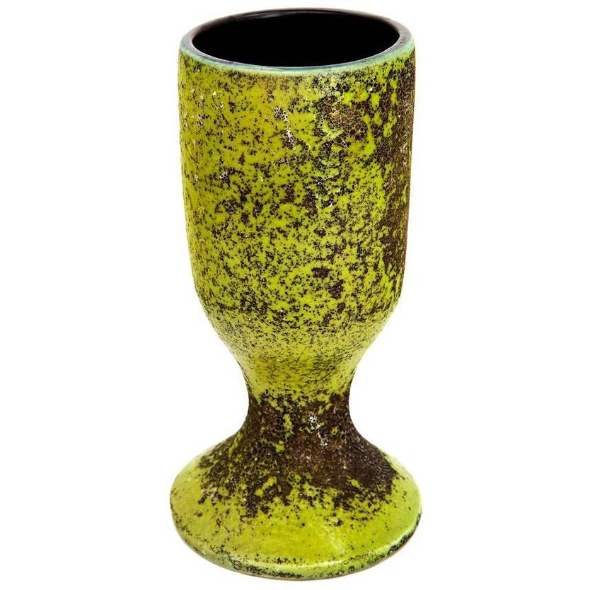 The chalice was a favorite form of Georges Jouve. This is an early example, distinguished by a complex surface texture that is most satisfying. Glazed in chartreuse, with a black interior. Signed JOUVE.