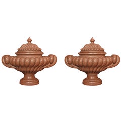A pair of mid 19th century red solid porphyr marble urns