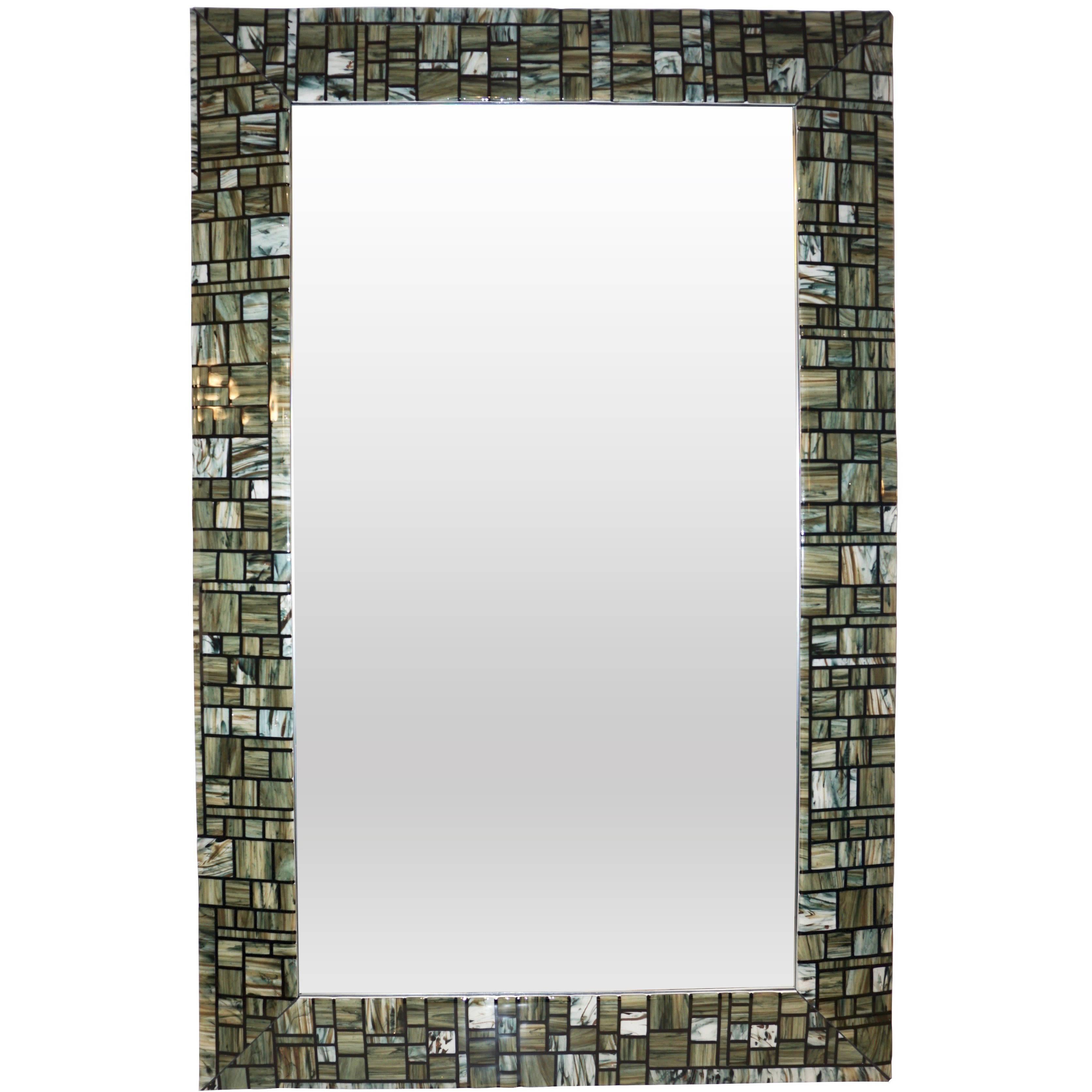 Contemporary Italian Murano glass mirror, exclusive Venetian work of art for Cosulich interiors by Veve Glass, skillfully and Masterly realized as an abstract earth tones mosaic with the Fusion technique, each individually handcrafted geometric