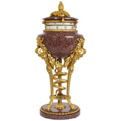 Französische Kaminuhr im neoklassischen Stil aus Goldbronze und Porphyr, Cercle Tournant