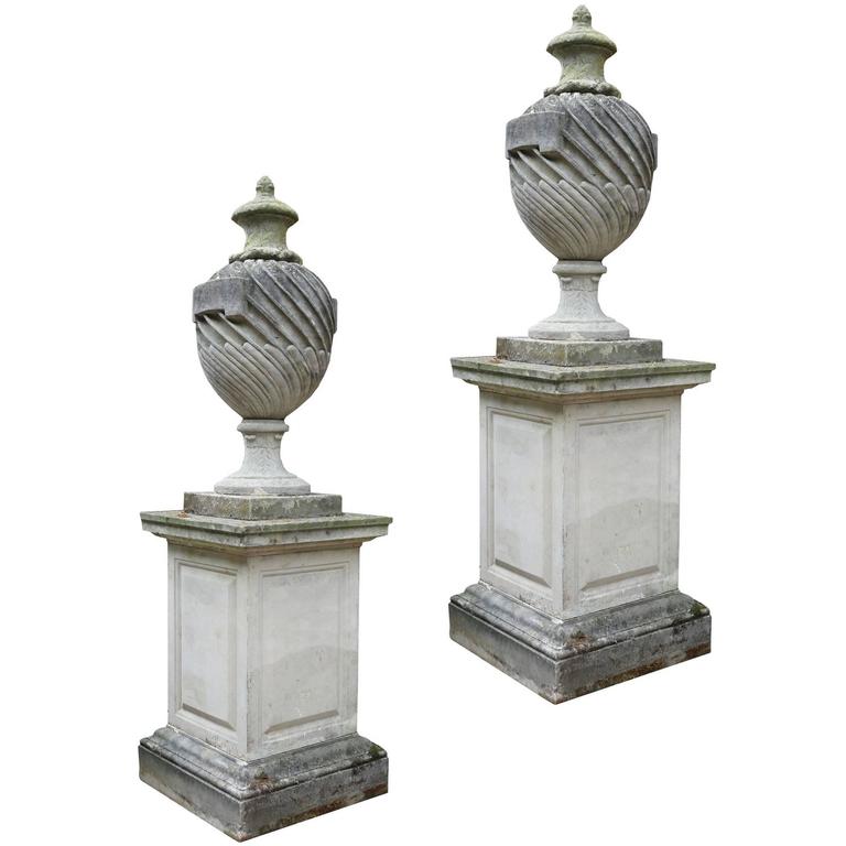 Pair of 20th Century Composition Stone Lidded Urns on Plinths at 1stDibs