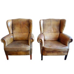 Pair of Early 20th Century Brown Leather Wingback Armchairs 10