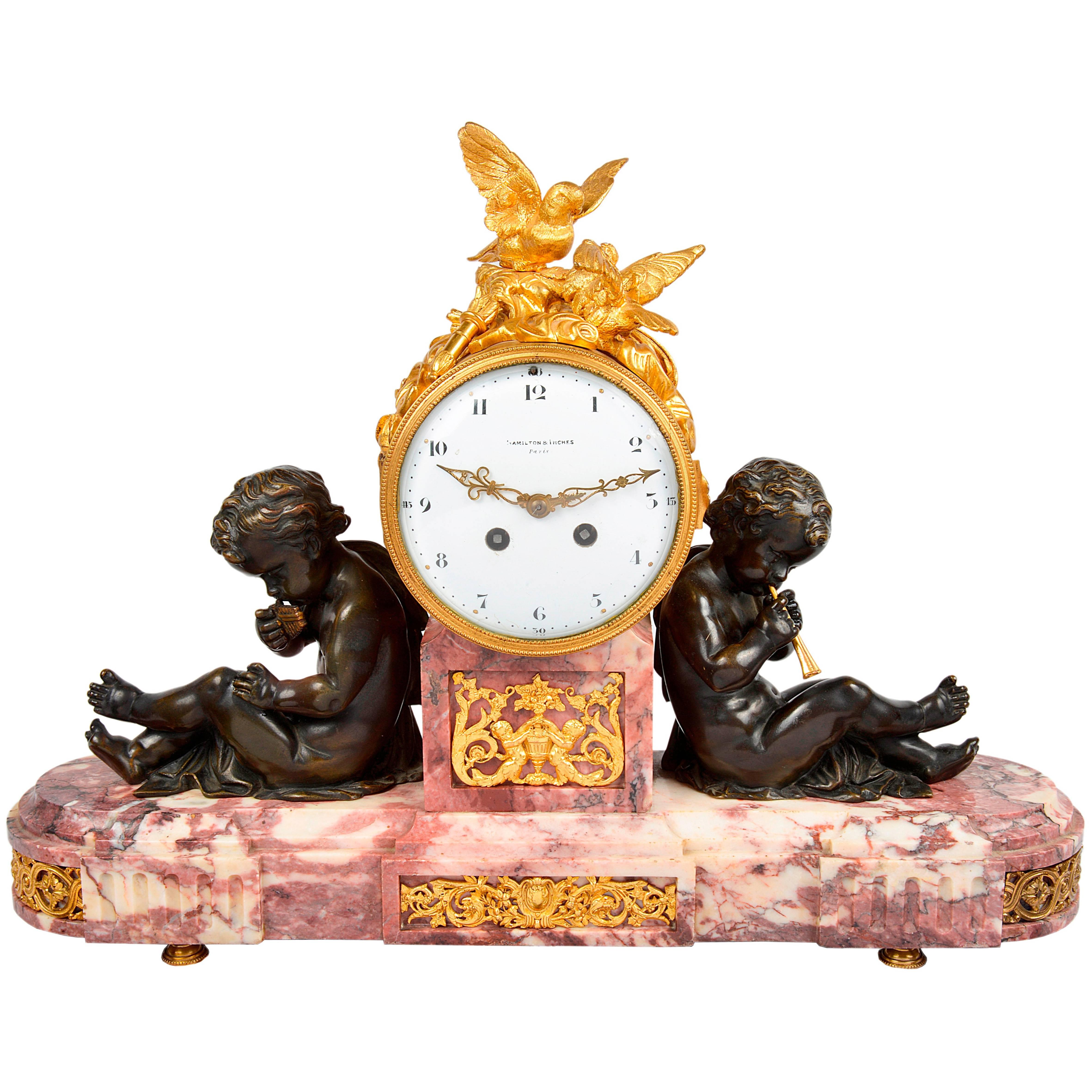 Louis XVI Style Mantel Clock with Doves and Putti Playing Pipes For Sale