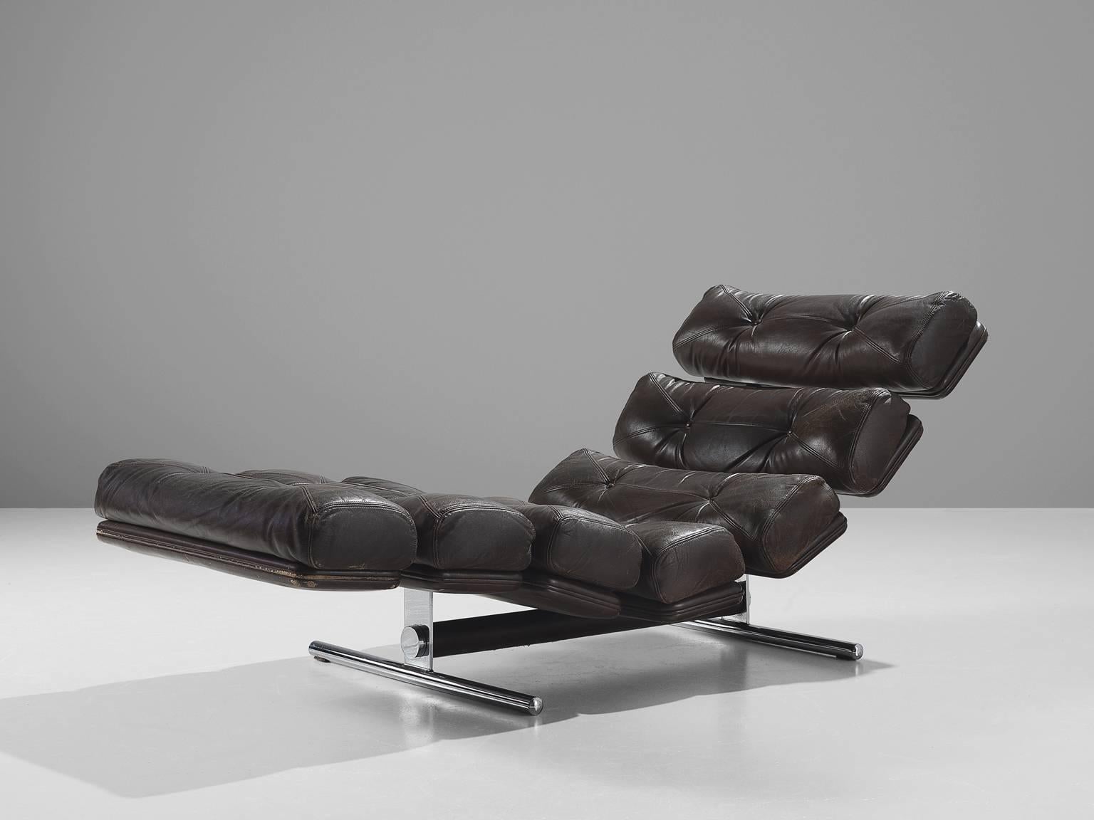 Chaise longue model 'Lord,' in original and steel, by Ric Deforche for Gervan, Belgium, 1970.

Fantastic daybed in dark brown original patinated leather and steel. This design dates from the 1970s. The segmented seating gives this lounge chair a