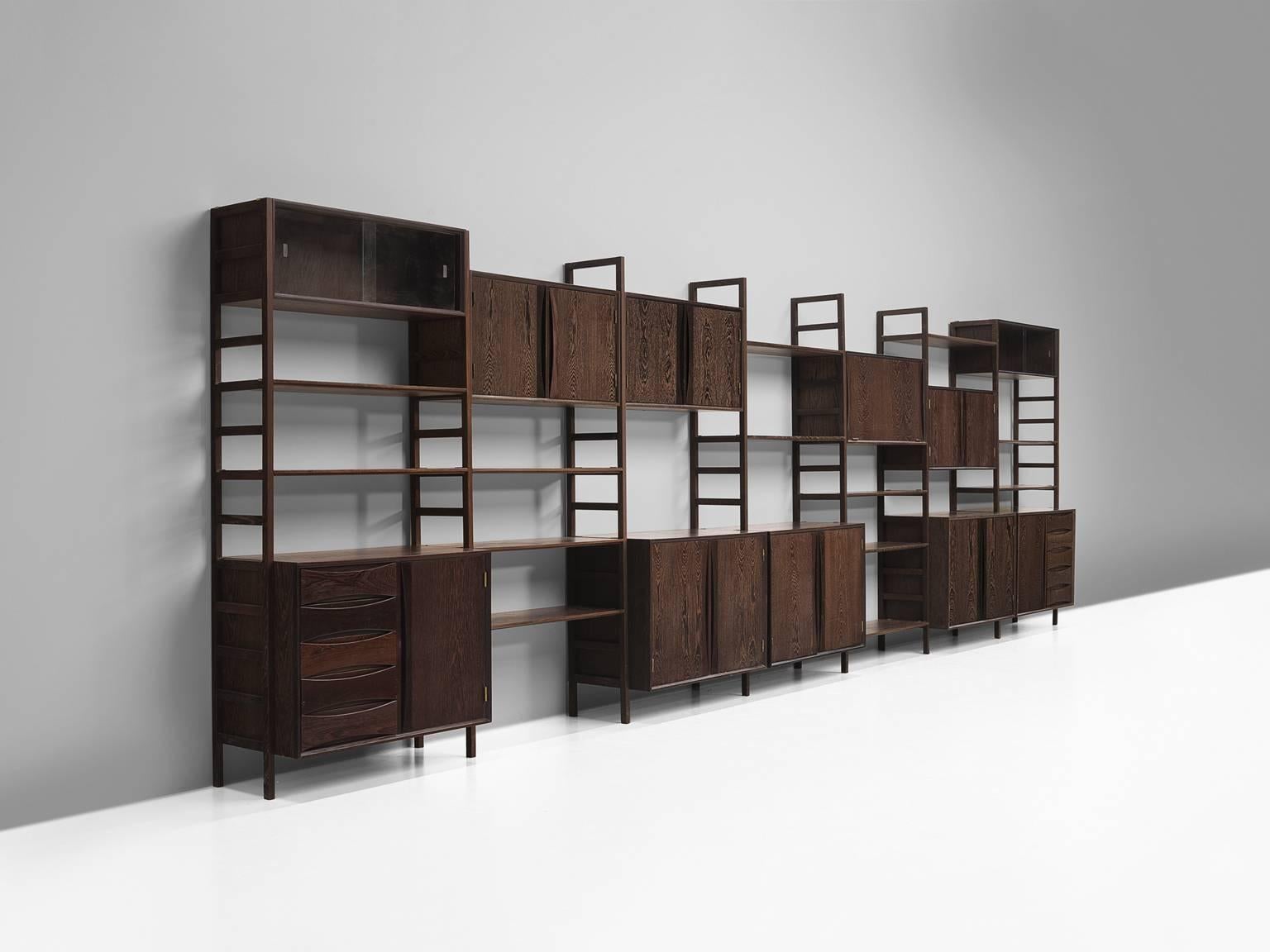 Wall unit, wenge and brass details, attributed to Oswald Vermaercke, Belgium, 1960s.

This wall unit represents the best of rich and solid material on the one hand and simplistic, balanced Belgian aesthetics on the other. The unit consists of three