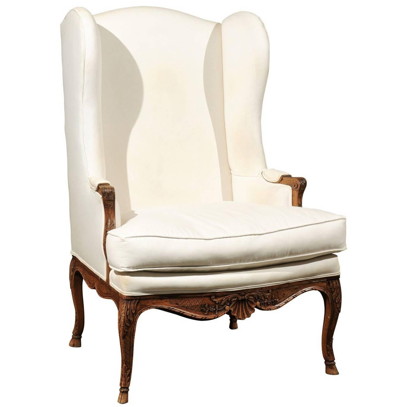 French Louis XV Style Early 19th Century Wingback Chair with Scalloped Skirt