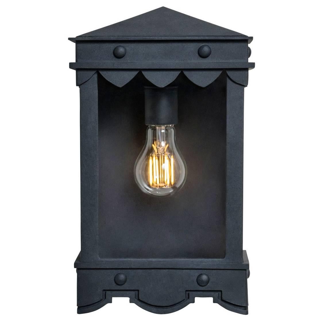 This lantern has Mediterranean style precedence with historic profiles and contemporized geometric lines. A striking fixture during the day but even more so at night when the patterned hem casts intricate shadows.

Lantern shown in SBLC Grey Finish