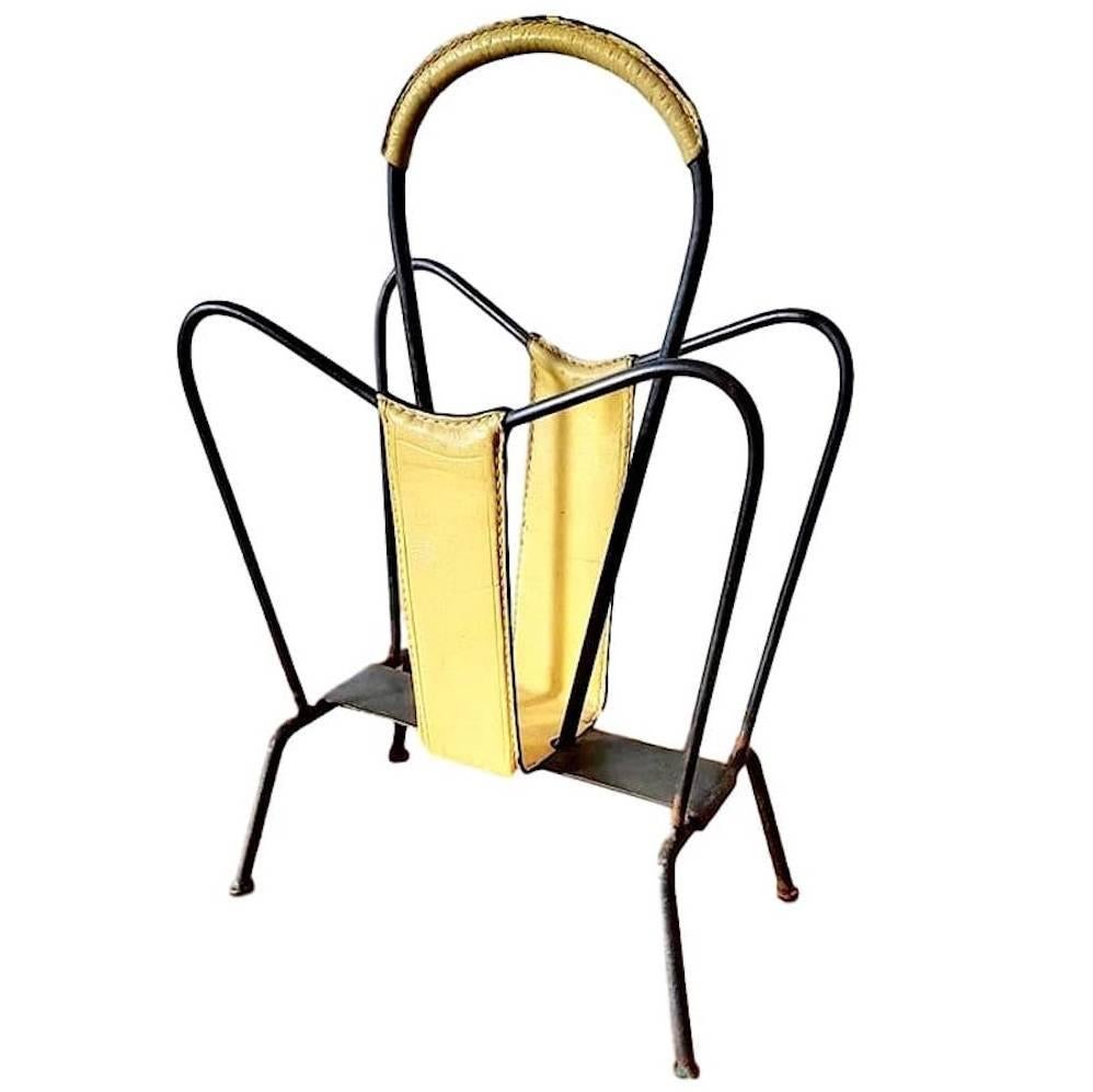 Interesting magazine rack by Jacques Adnet. Rare yellow leather color on iron frame. Good vintage condition. 

Matching magazine rack available in green leather in separate listing.