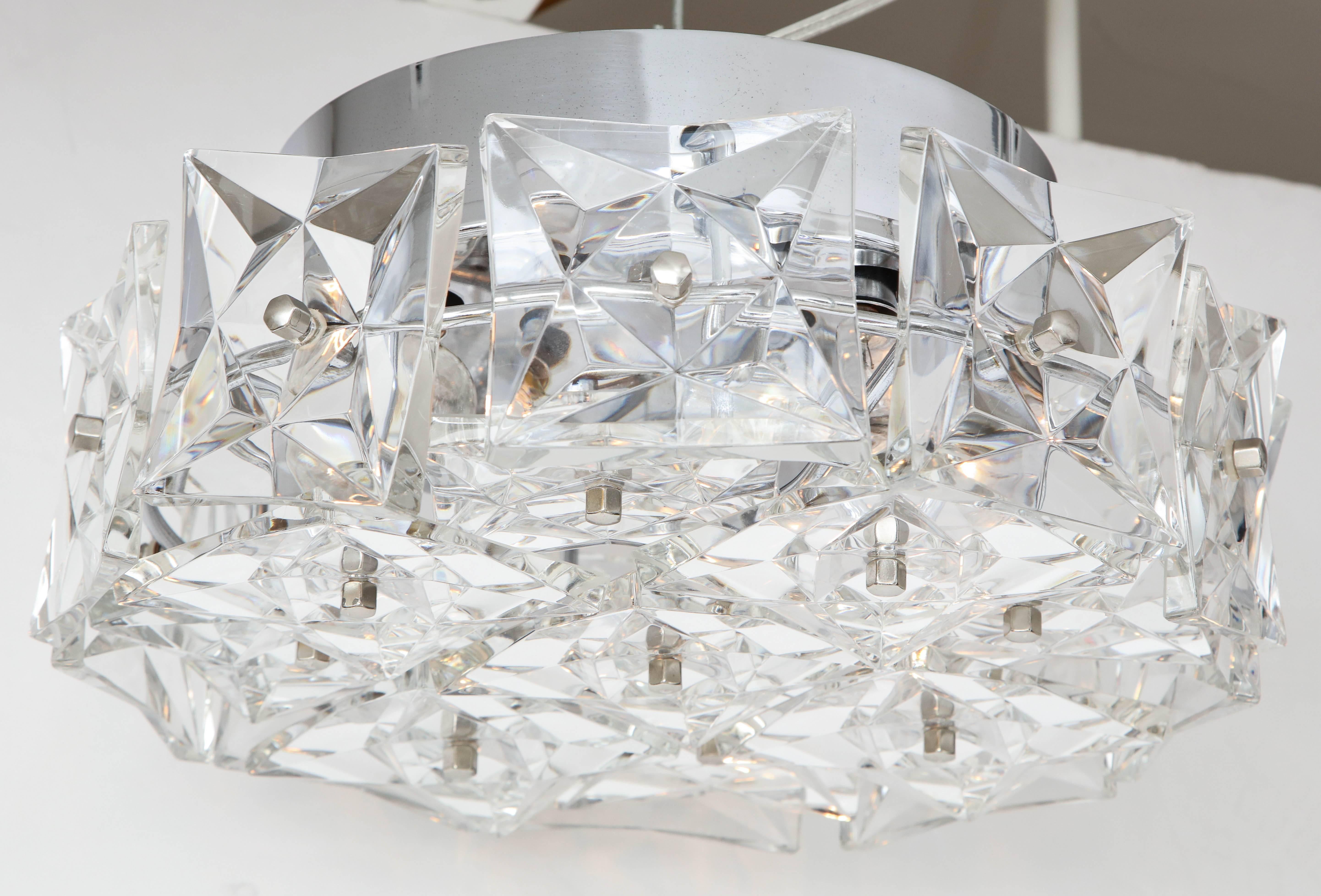 Ultra glam flush mount fixture featuring Austrian deep cut square crystal prisms on a polished nickel frame. Each fixture houses five light sources. Rewired for use in the USA.

Currently a pair is available.