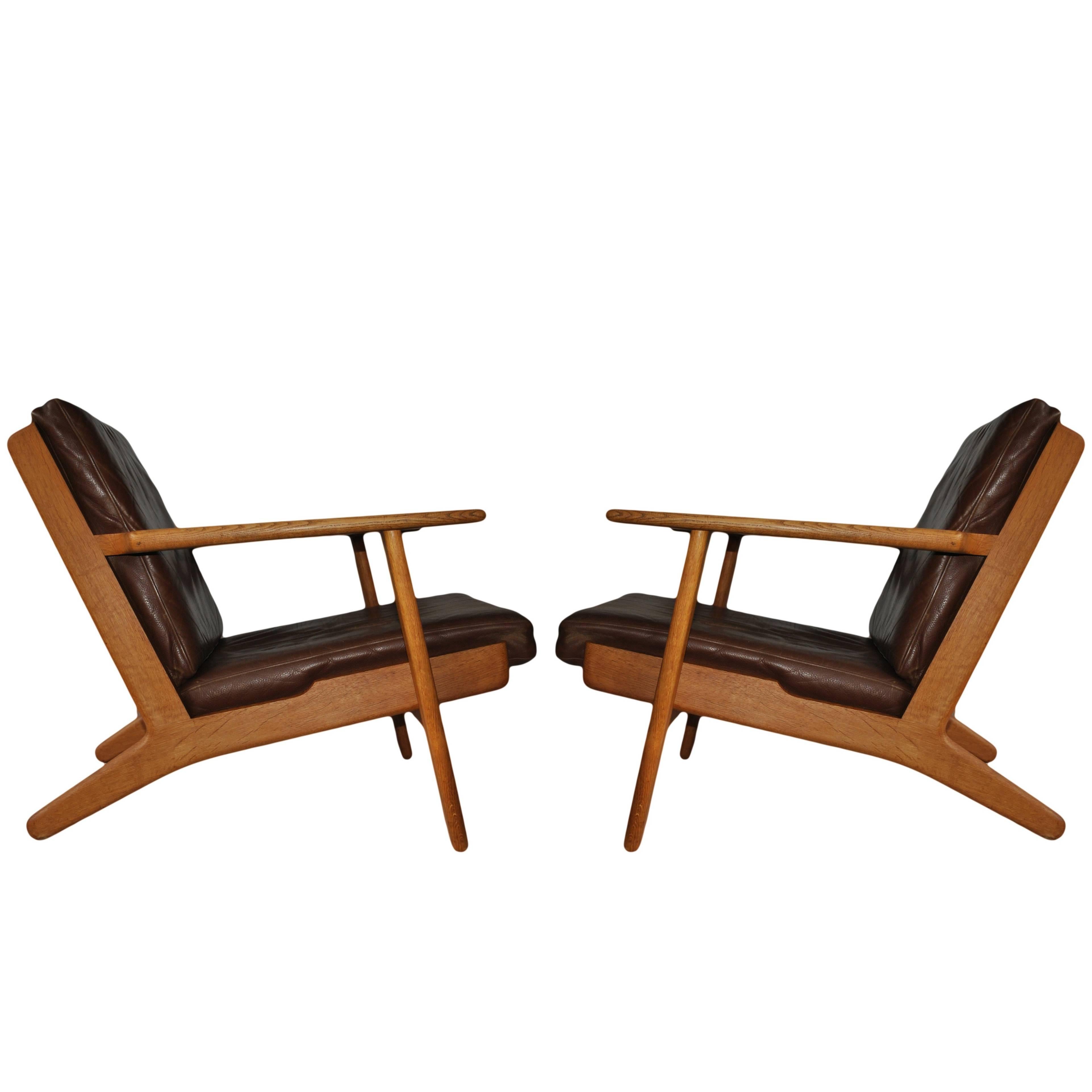 Pair of Hans J Wegner ge290 Oak Lounge Chairs, 1950s. Refurbished.