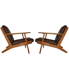 Pair of Hans J Wegner ge290 Oak Lounge Chairs, 1950s. Refurbished.