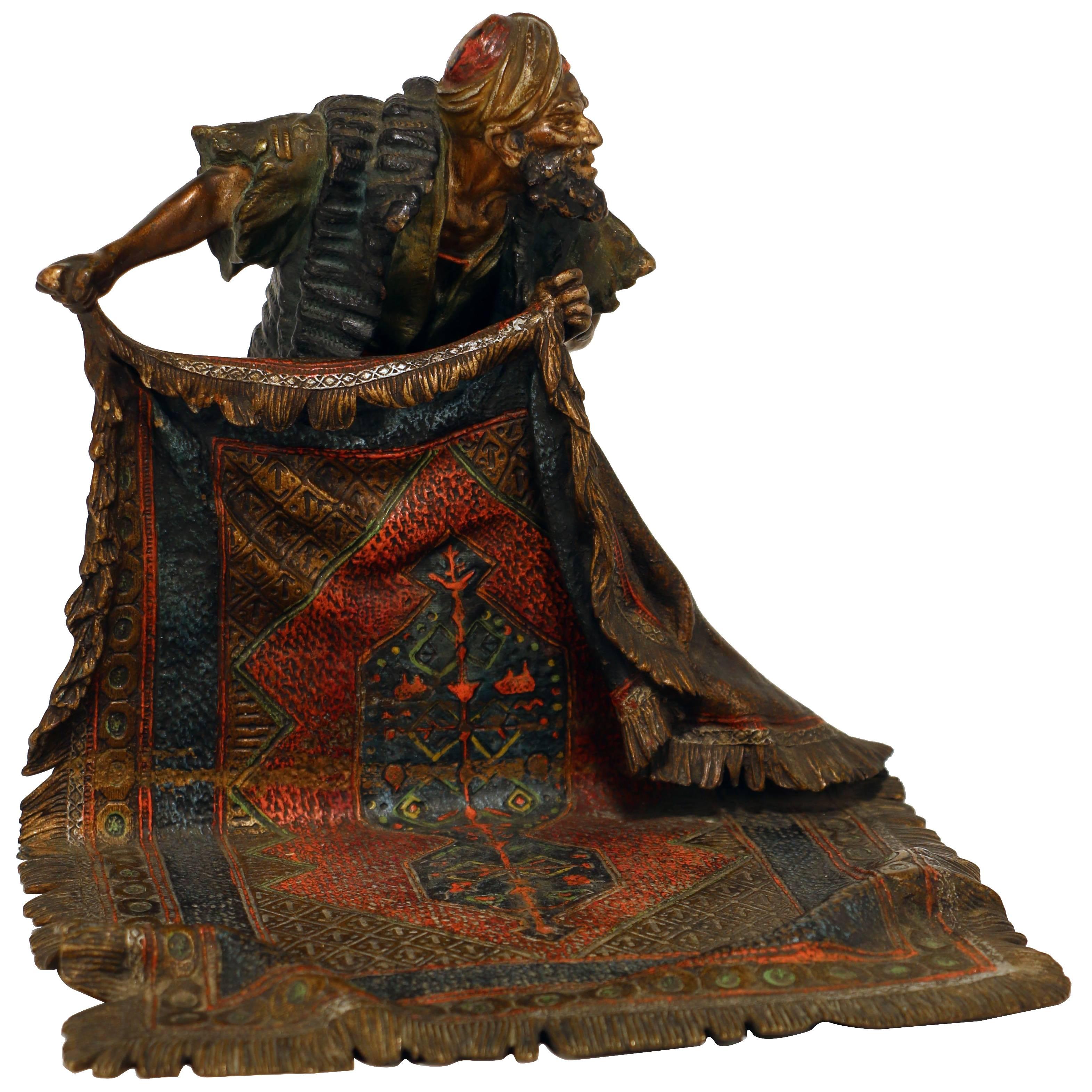 Good Bergman Bronze of a Arab Carpet Dealer Showing His Wares