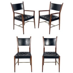 Set of Four Black Leather Walnut and Brass Dining Chairs by Paul McCobb