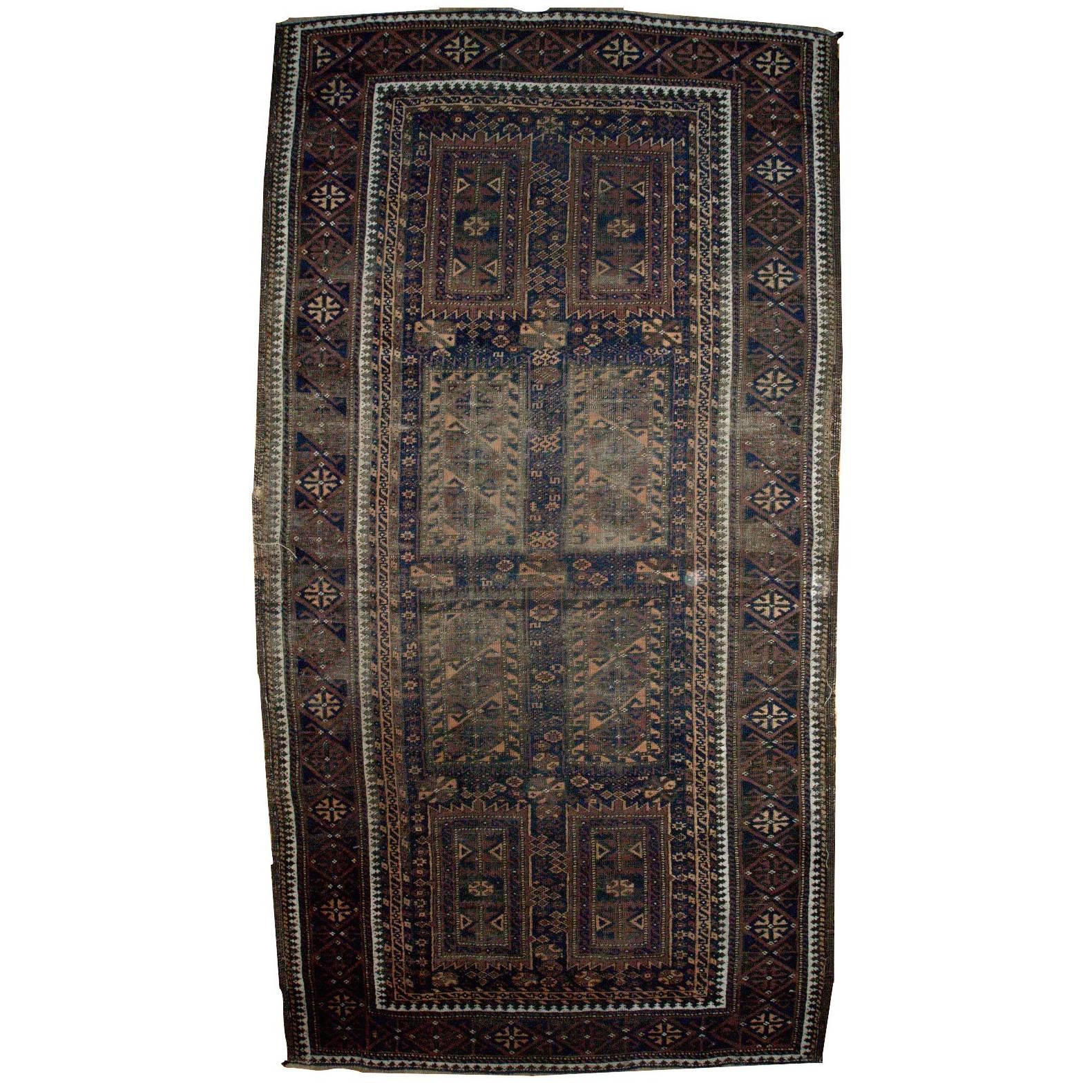 Handmade Antique Distressed Afghan Baluch Oriental Rug, 1900s, 1C227 For Sale