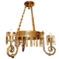 Coppia di lampadari neoclassici in bronzo dorato