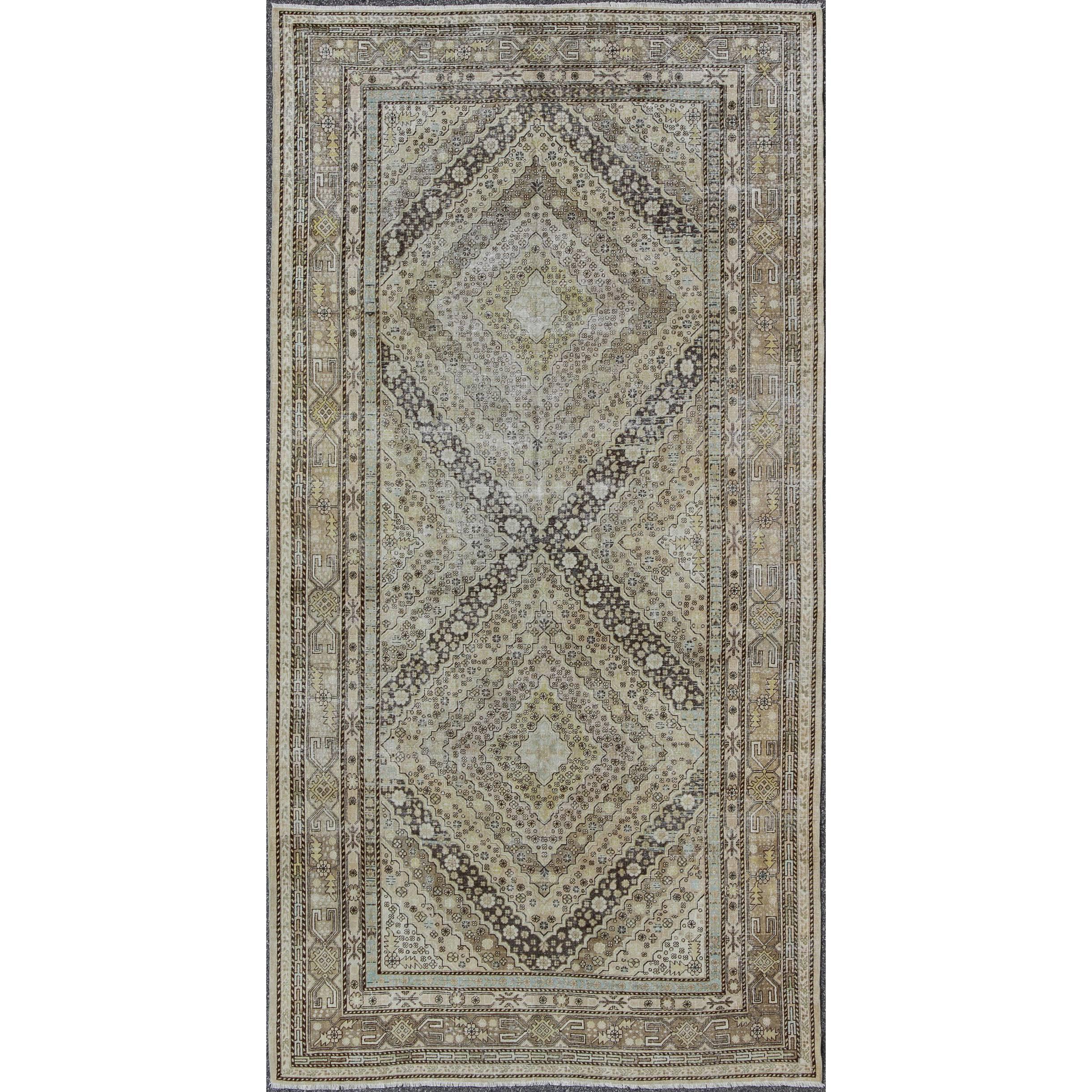 Antique Turkestanian Khotan Rug with Paired Diamond Geometric Medallions For Sale