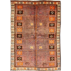 Vintage Persian Gabbeh Rug with Variegated Purple Central Field 
Tribal Motifs