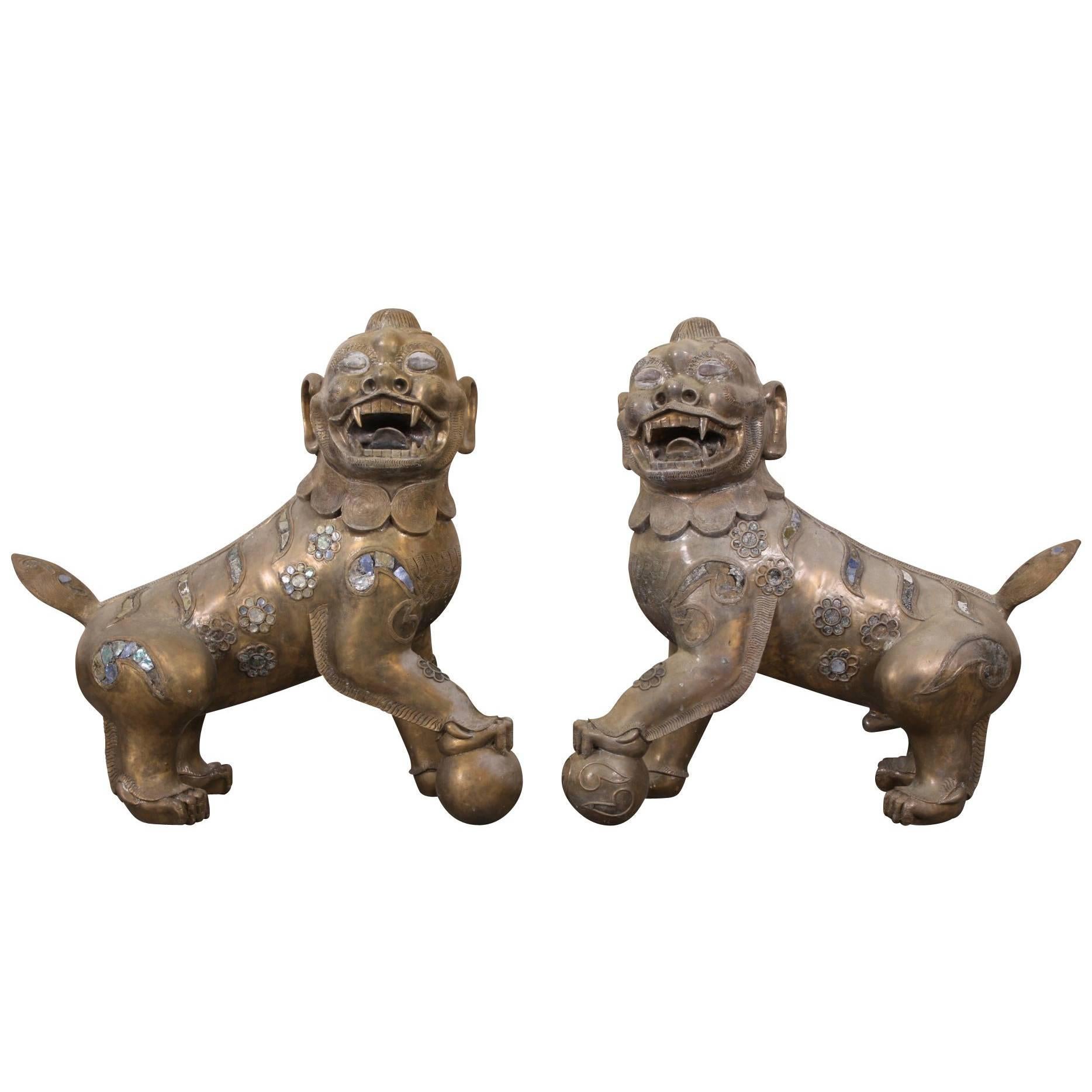 Pair of Tibetan Bronze Guardian Lion Figures For Sale