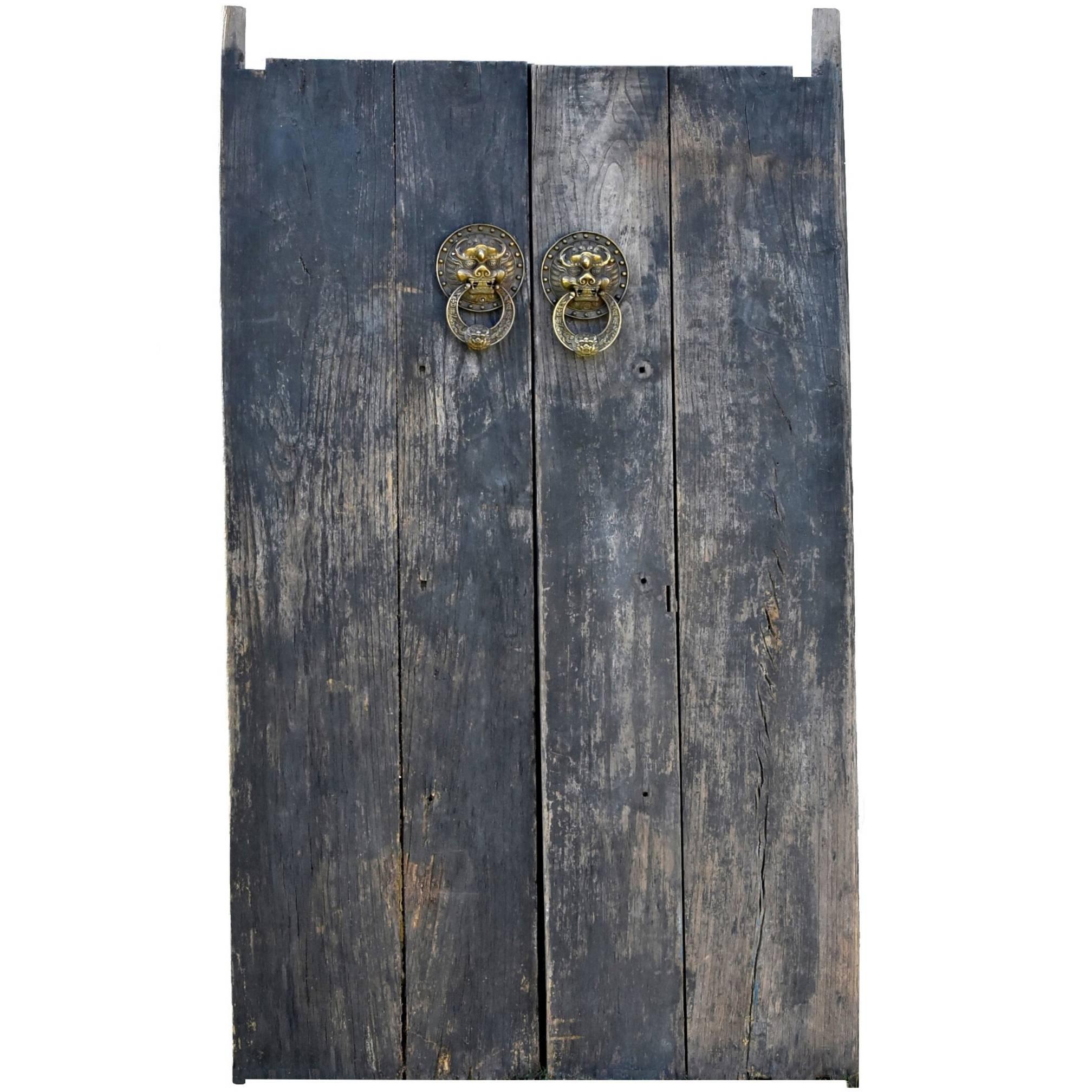 Rustic Antique Doors with Brass Knockers