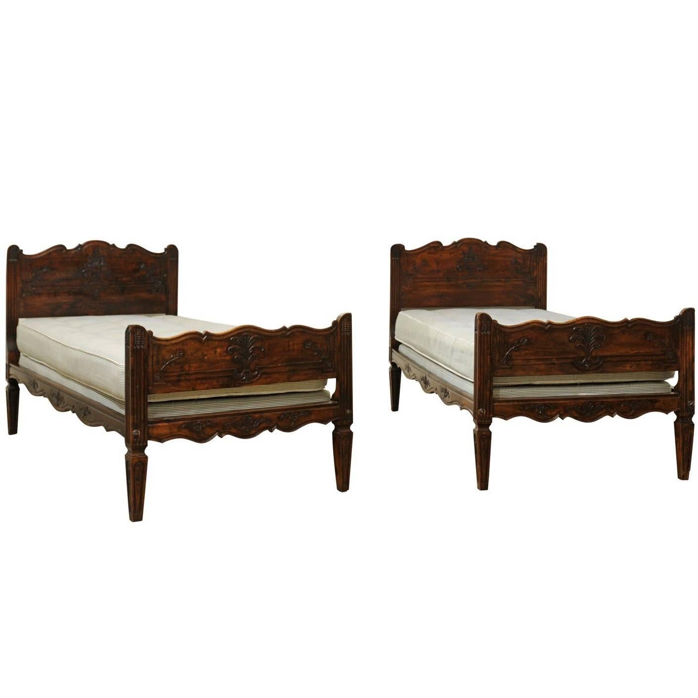 Pair of French 19th Century Walnut Twin Beds with Carved Headboard and Footboard