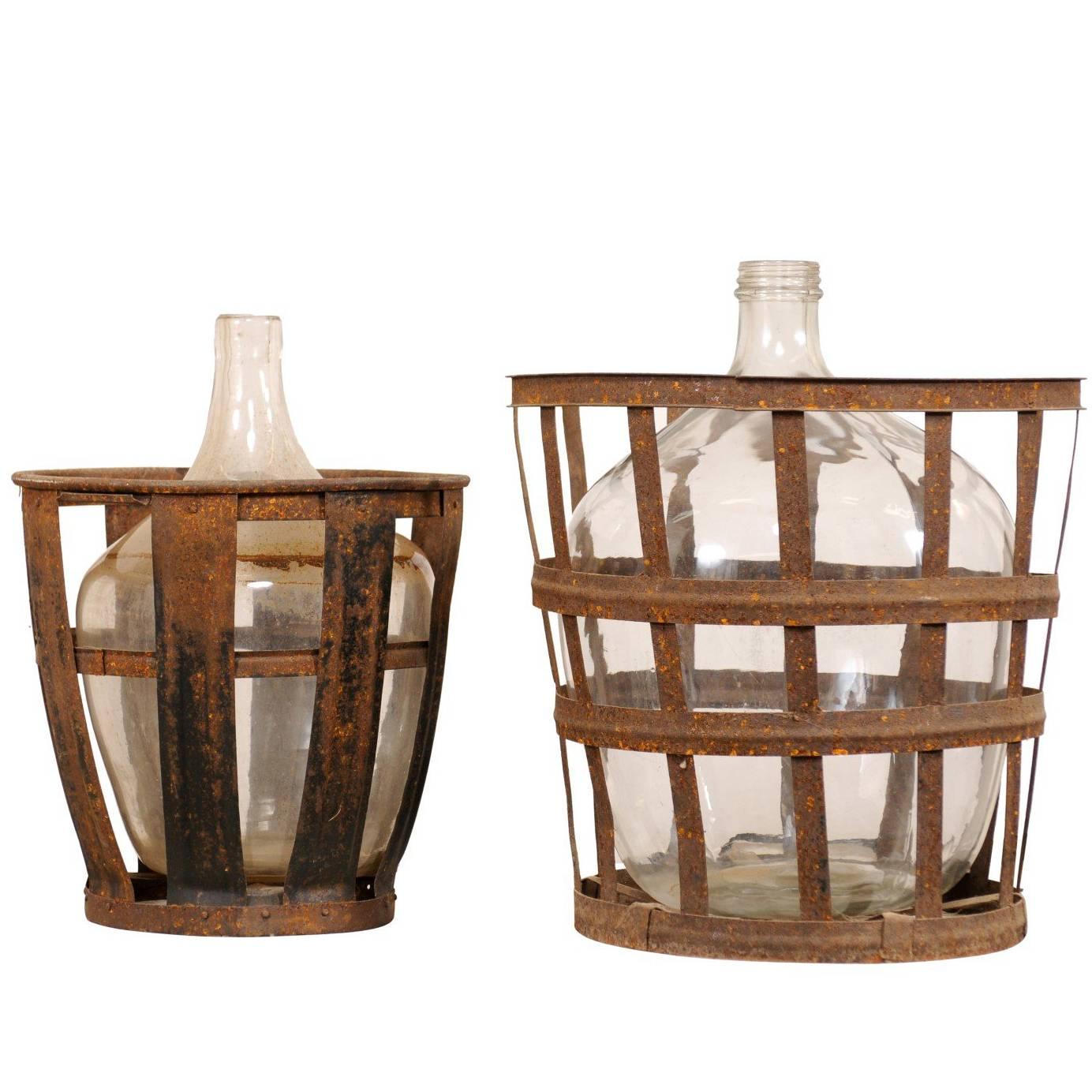 Pair of French Mid-20th Century Vintner Iron Baskets with Demijohn Wine Bottles