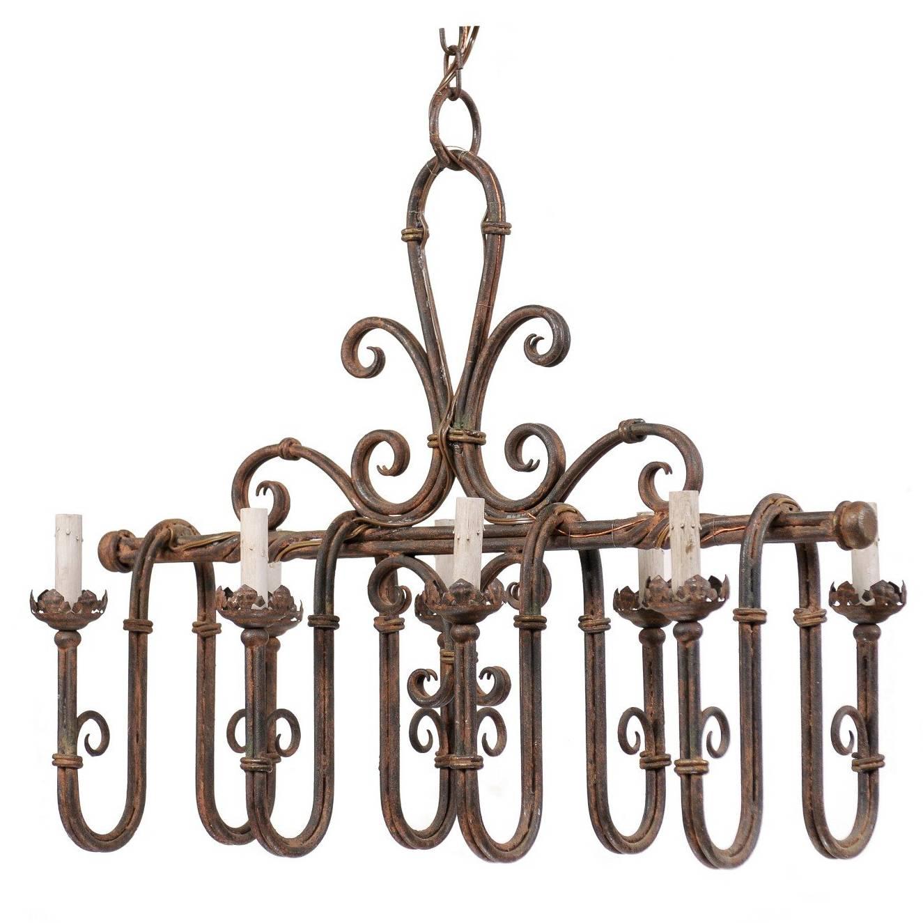 An Elaborate French Iron 8-Light Chandelier w/Deep Swag Arms & Fleur-De-Lis Top