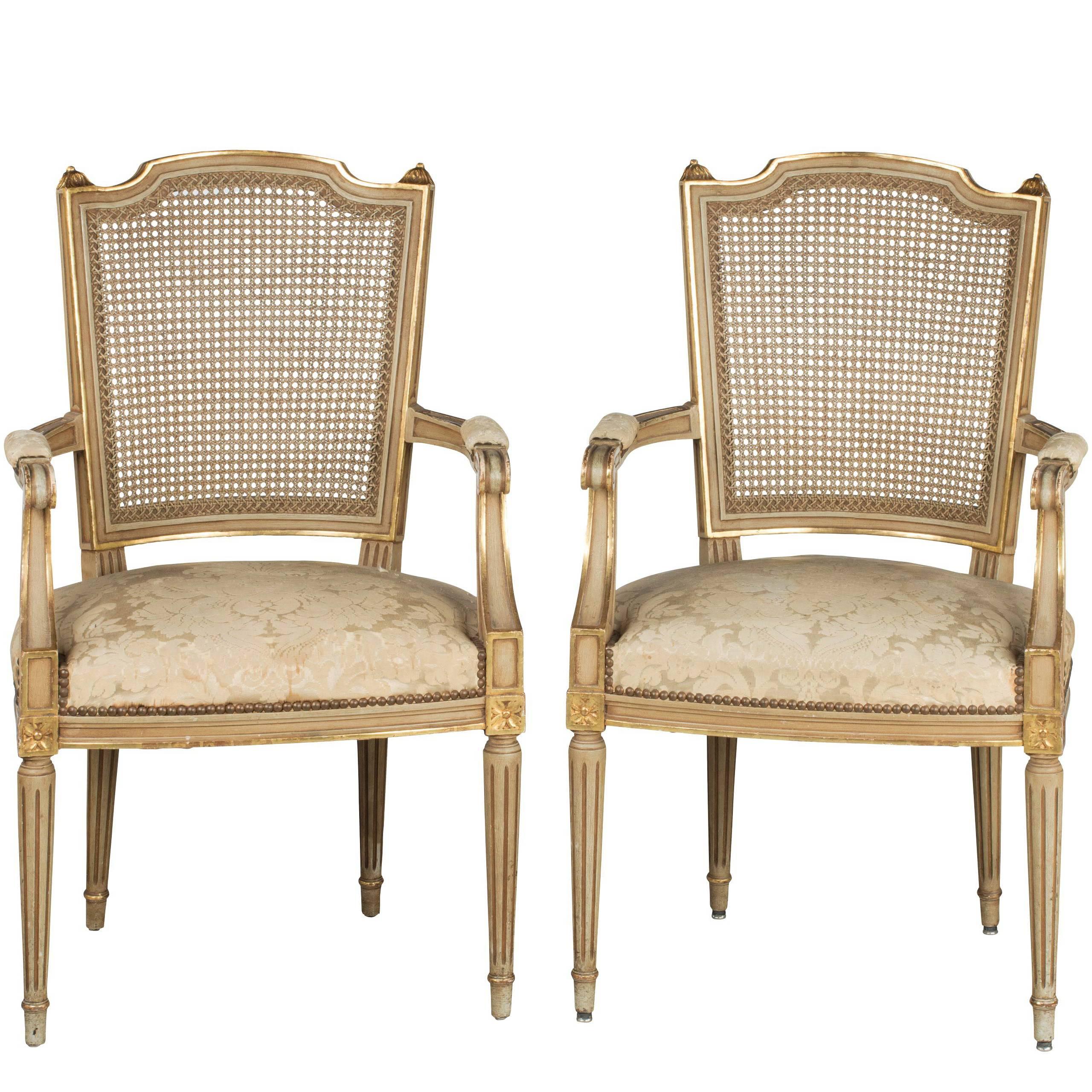 Pair of Early 20th Century French Painted and Parcel-Gilt Elbow Chairs
