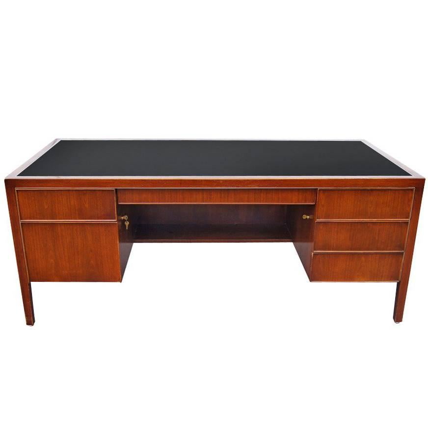 Known for superb quality, this Stow Davis desk is fit for any office or home office. The desk features one pencil drawer, four standards drawers, one file drawer, and a black lined composite top.  