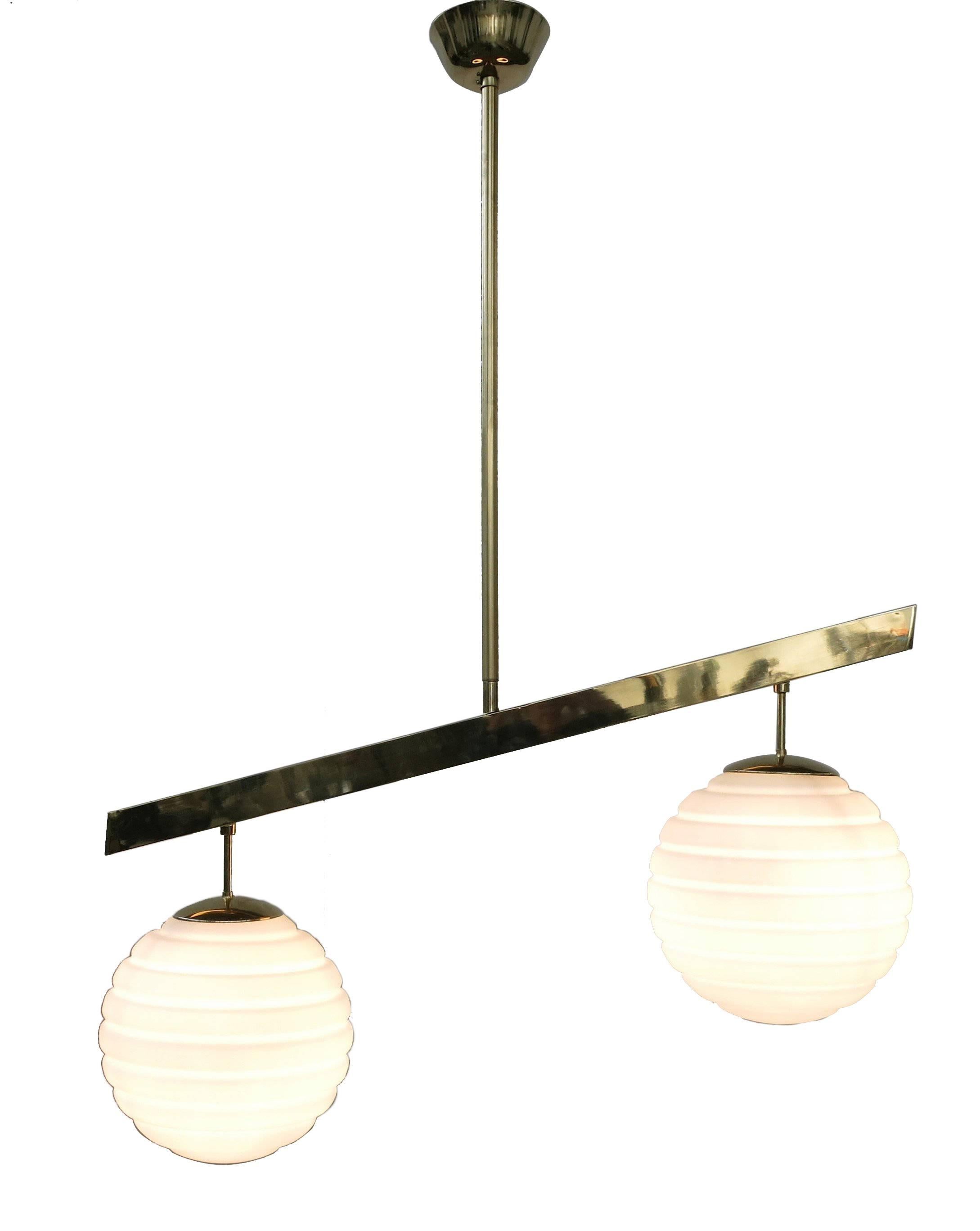 Italian modern pendant with frosted white ribbed Murano glass globes, mounted on polished brass frame / Designed by Fabio Bergomi for Fabio Ltd / Made in Italy 
2 lights / E26 or E27 type / max 60W each  
Height: 52 inches / Width: 39.5 inches /
