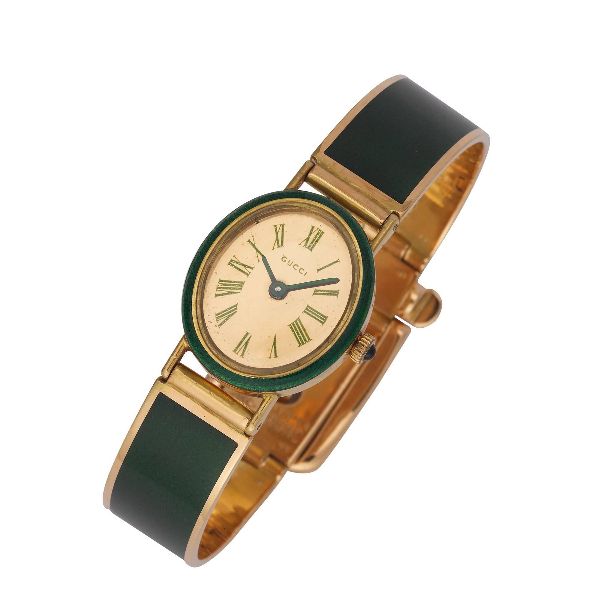 Gucci Lady's Yellow Gold Cabochon Sapphire Bangle Wristwatch For Sale