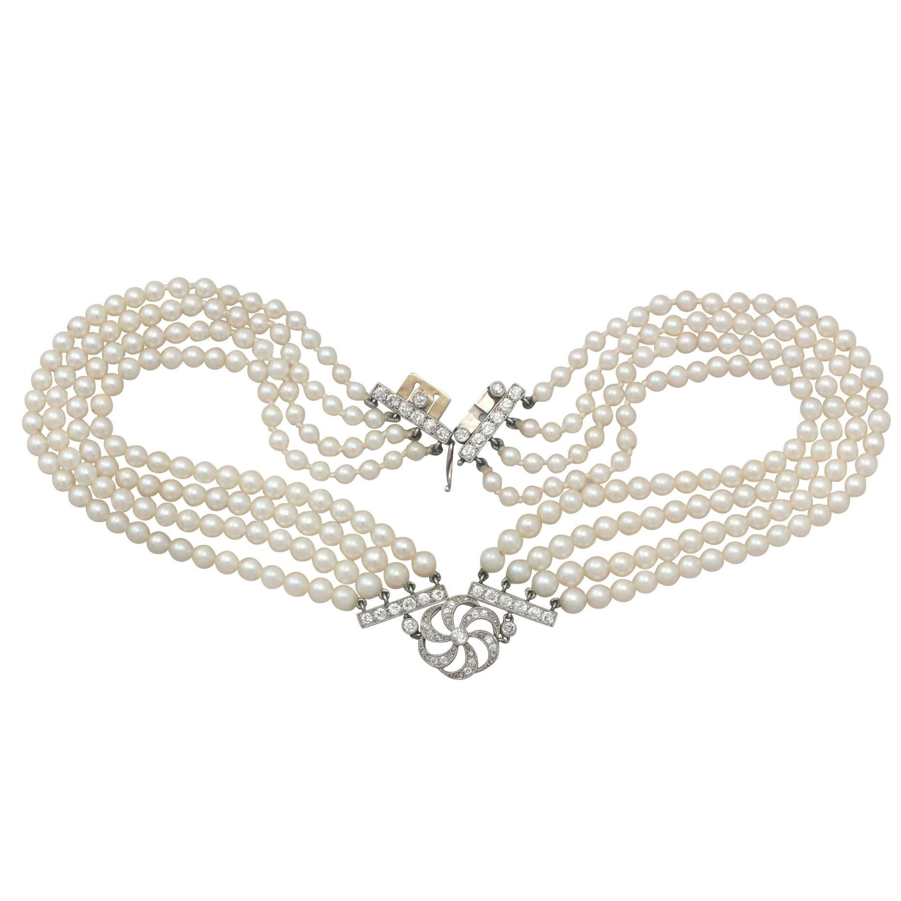 A stunning, fine and impressive four strand pearl choker with a 1.32 carat diamond set feature and platinum clasp; part of our diverse necklace and pendant collection

This stunning, fine and impressive pearl and diamond choker displays a single