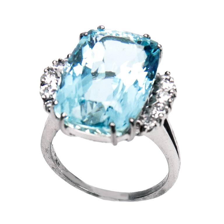 Simply Beautiful! Classic and Timeless, centering a large rectangular 18.02 carat Cushion Aquamarine, enhanced either side with five Brilliant-cut Diamonds with an approx total weight of 0.50 carat. Hand crafted  18k White Gold mounting.  Ring size