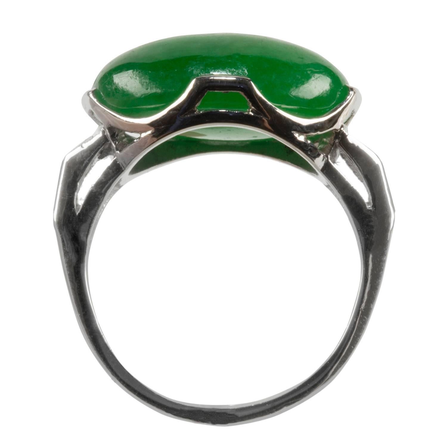 This beautiful jade and diamond ring is set in platinum flanked with baguette cut diamonds.  The natural jadeite jade has an AGL certificate.  There is no evidence of treatment.  The ring is a size 8, but we can easily resize it.