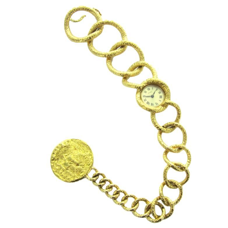 An Early 70's Salvador Dali Yellow Gold Bracelet Watch with Coin by Piaget