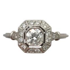 Antique and Contemporary 0.65 Carat Diamond and Platinum Halo Style Ring