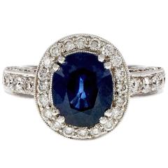 Oval 3.48 Carat Royal Blue Sapphire Diamond Gold Halo Engagement Ring 7