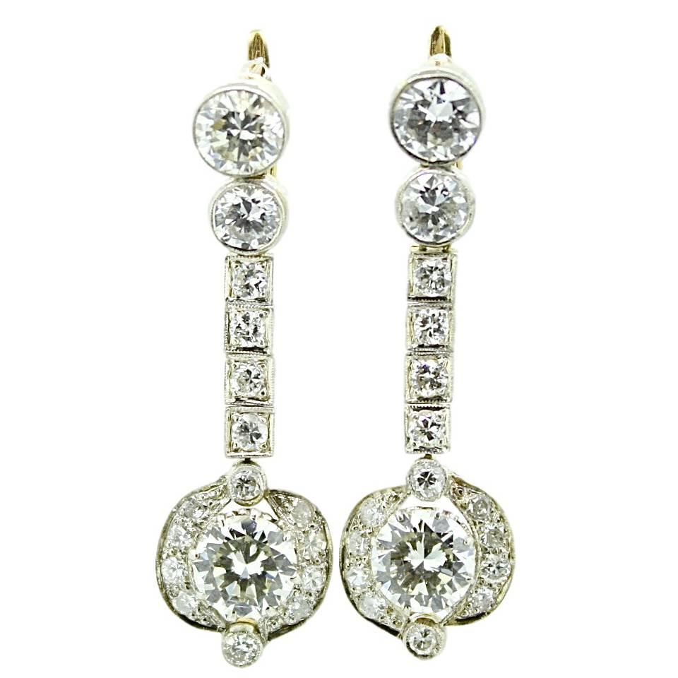 Art Deco 8 Carat White Diamond Yellow Gold Dangle Earrings For Sale