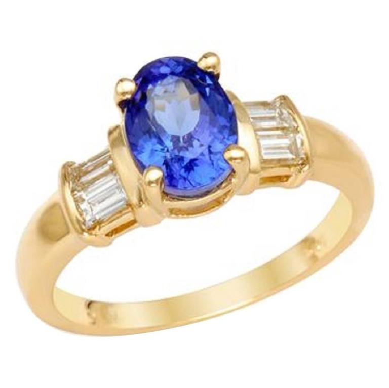 Oval Tanzanite Baguette Diamond and Gold Ring For Sale