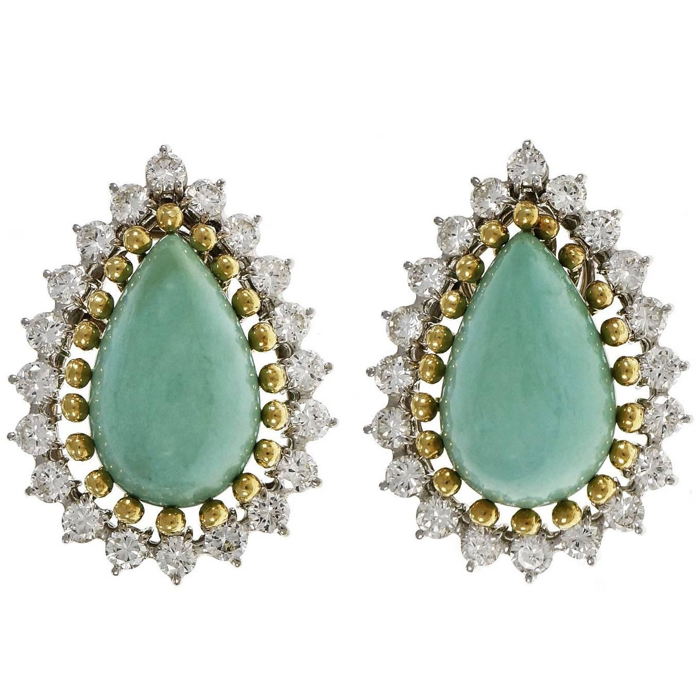 Mid-Century 1950s GIA certified natural Turquoise and diamond clip post earrings. Natural untreated Persian Turquoise surrounded by bright white full cut diamonds. Earrings are in 14k white gold with 18k yellow gold bands surrounding the