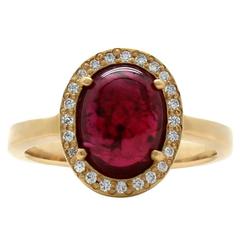 Oval Ruby Cabochon Diamond Halo Ring