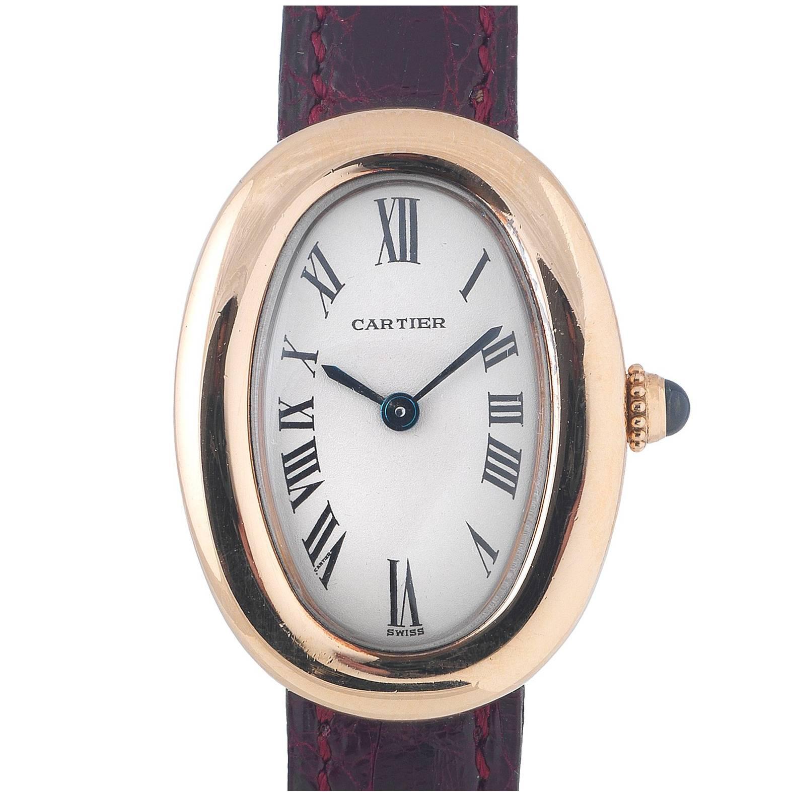 PLEASE NOTE: OUR PRICE IS FULLY INCLUSIVE OF SHIPPING, IMPORTATION TAXES & DUTIES.

Cartier. A lady's 18K gold quartz oval wristwatch Model: Baignoire Reference: 0332 Date: Circa 1990 Movement: 4-jewel Cal.157 quartz Dial: Silvered, black Roman