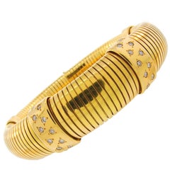1970s Cartier Diamond Yellow Gold Tubogas Bracelet