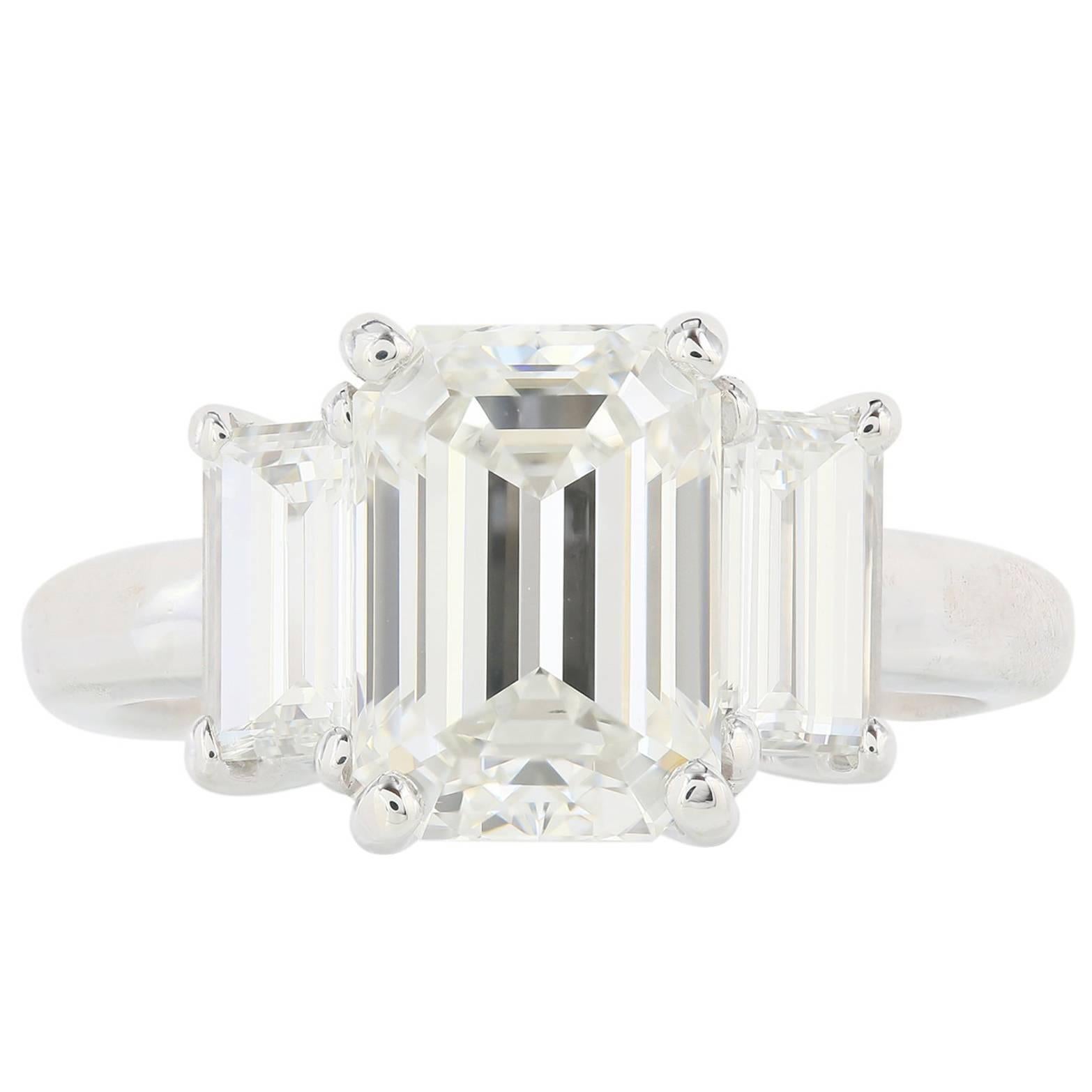 GIA Certified 3.01 Carat Emerald Cut Three Stone Diamond Engagement Ring For Sale