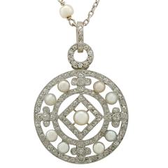 1920s Seed Pearl and 1.11 Carat Diamond, Platinum Pendant 1