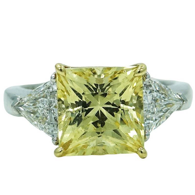 White Gold Ring with 5.16 Carat Yellow Sapphire and Two Trillion Diamonds For Sale