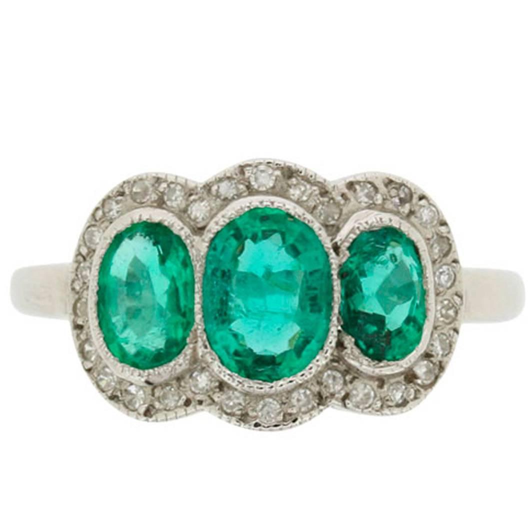 Vintage Triple Halo Emerald and Diamond Ring, circa 1950s