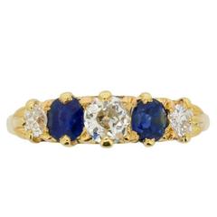 Old Cut Diamond and Oval-Shaped Sapphire Five-Stone Ring, circa 1900s