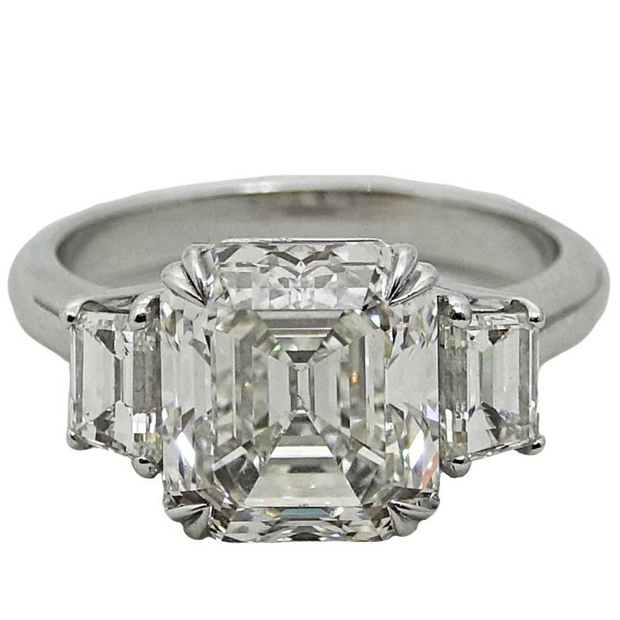 5.02 Carat Emerald Cut Diamond Platinum Engagement Ring For Sale